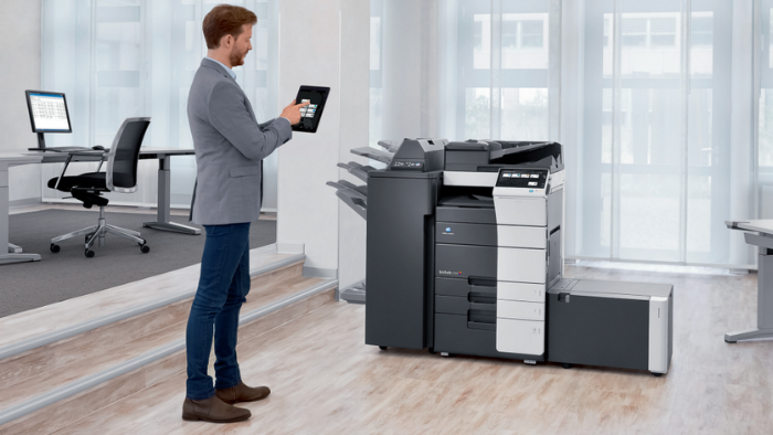 Man controls his printer using his tablet